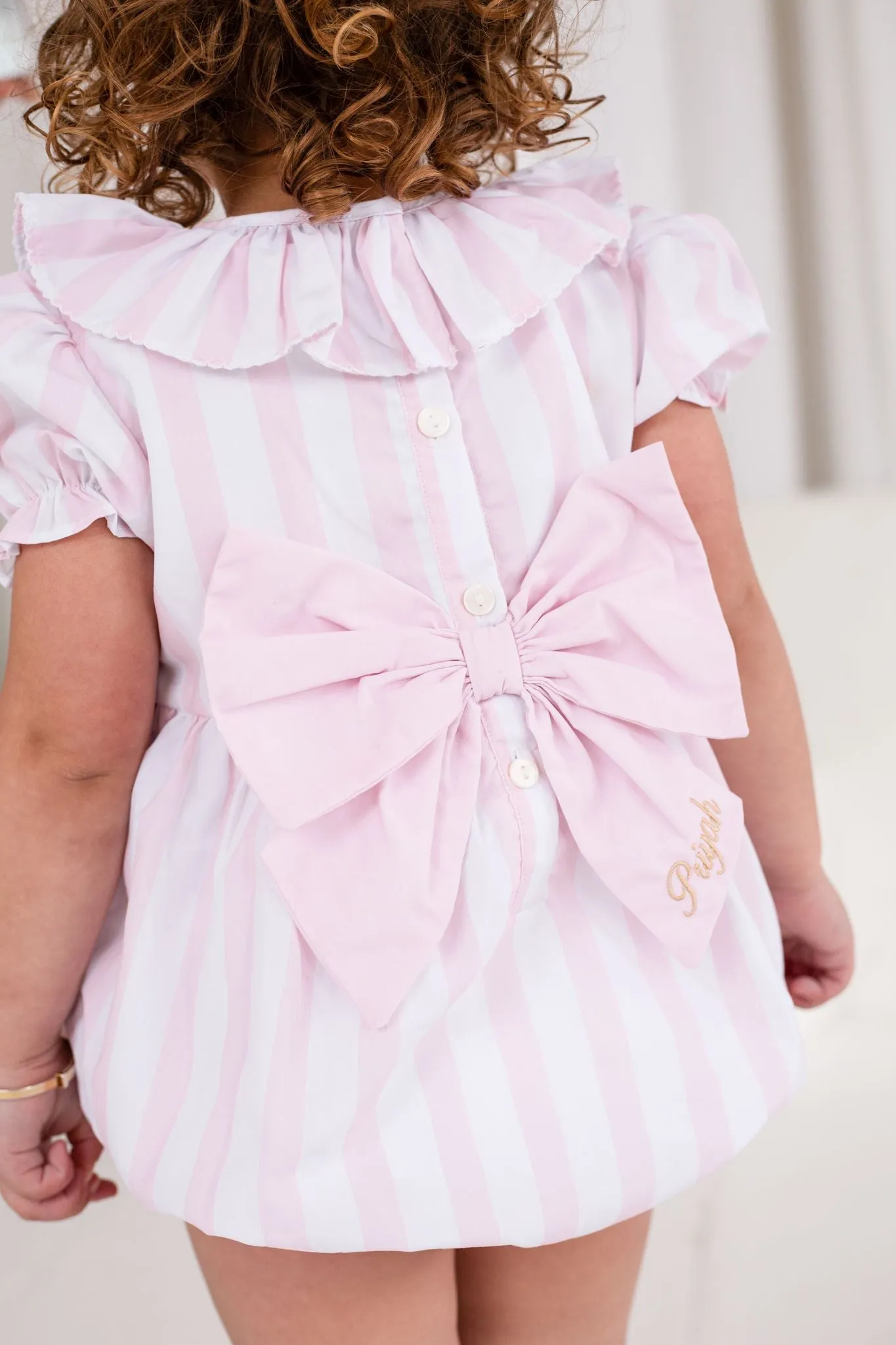 Girls Pink Candy Stripe Smocked Romper
