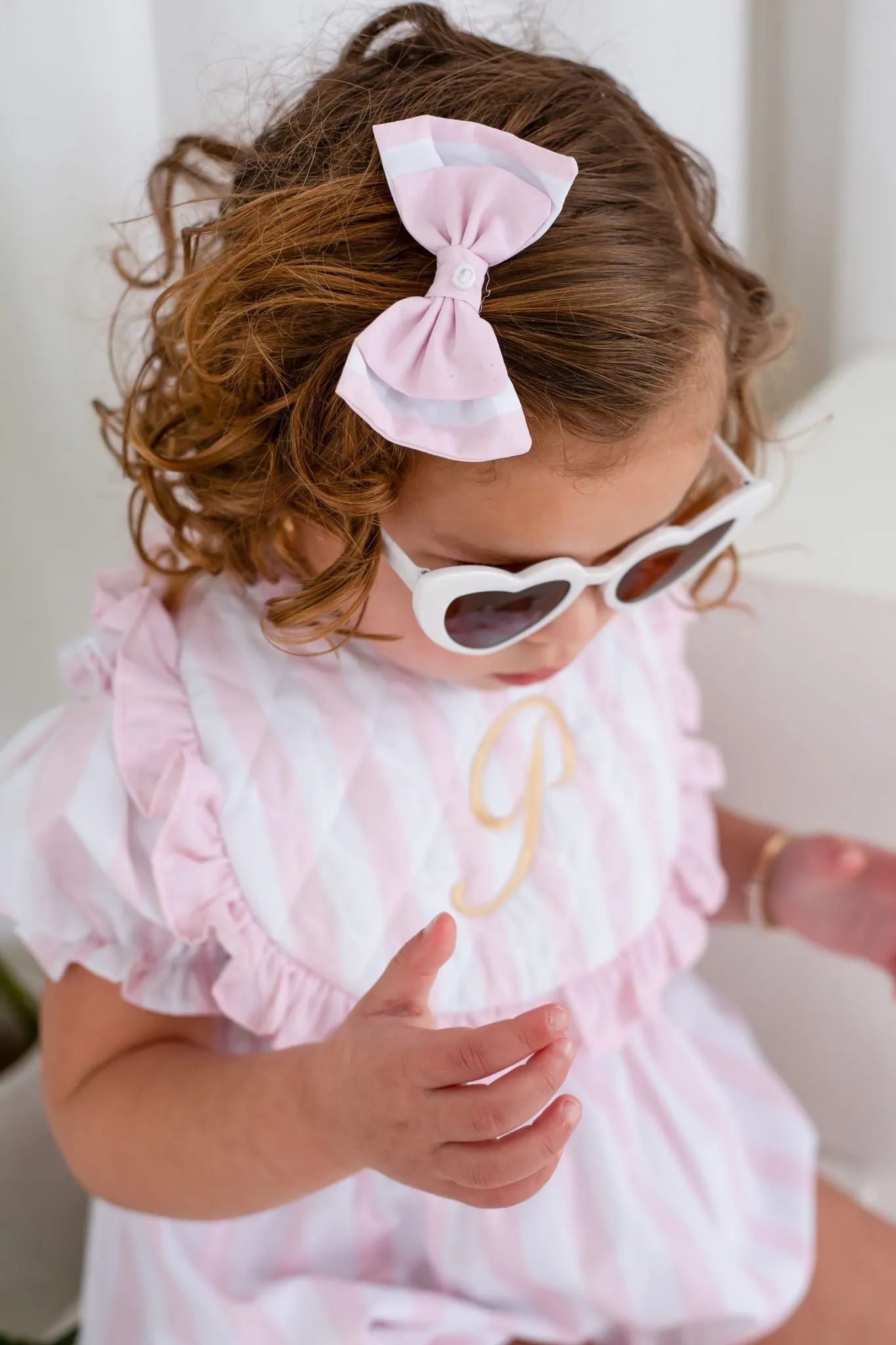 Girls Pink Candy Stripe Smocked Romper