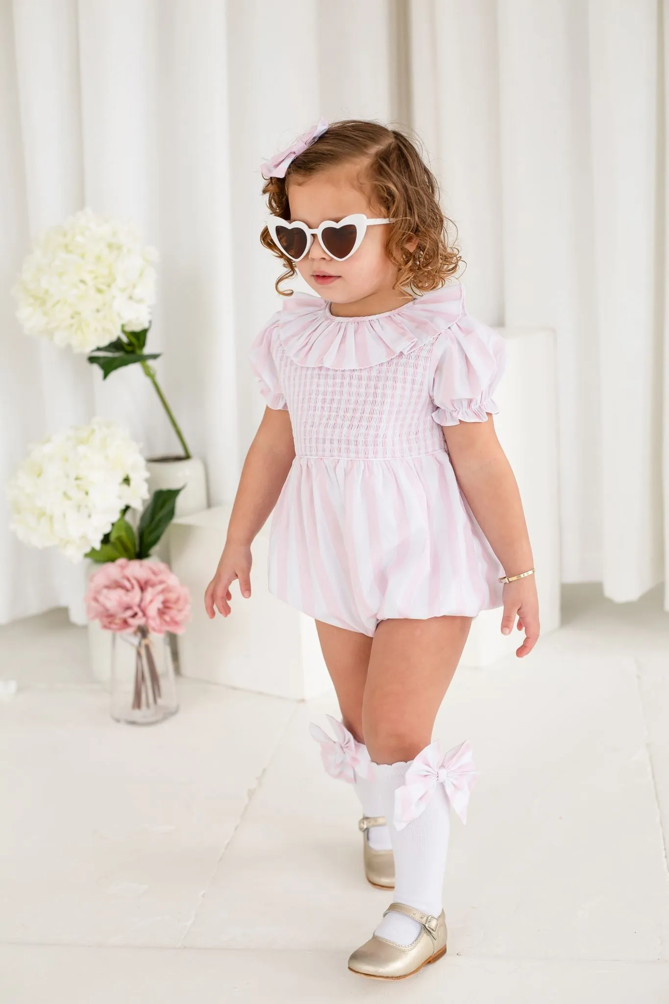 Girls Pink Candy Stripe Smocked Romper