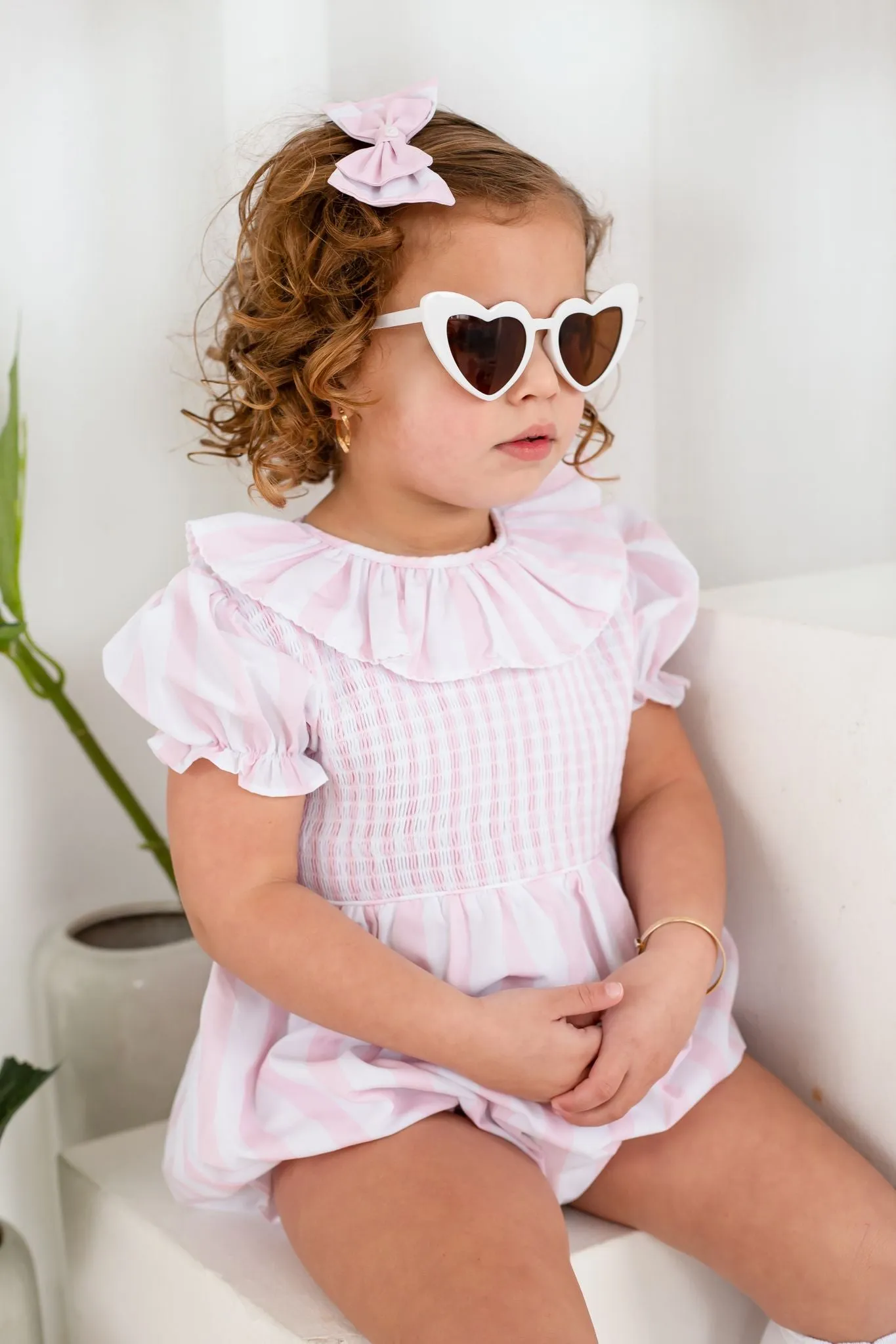 Girls Pink Candy Stripe Smocked Romper