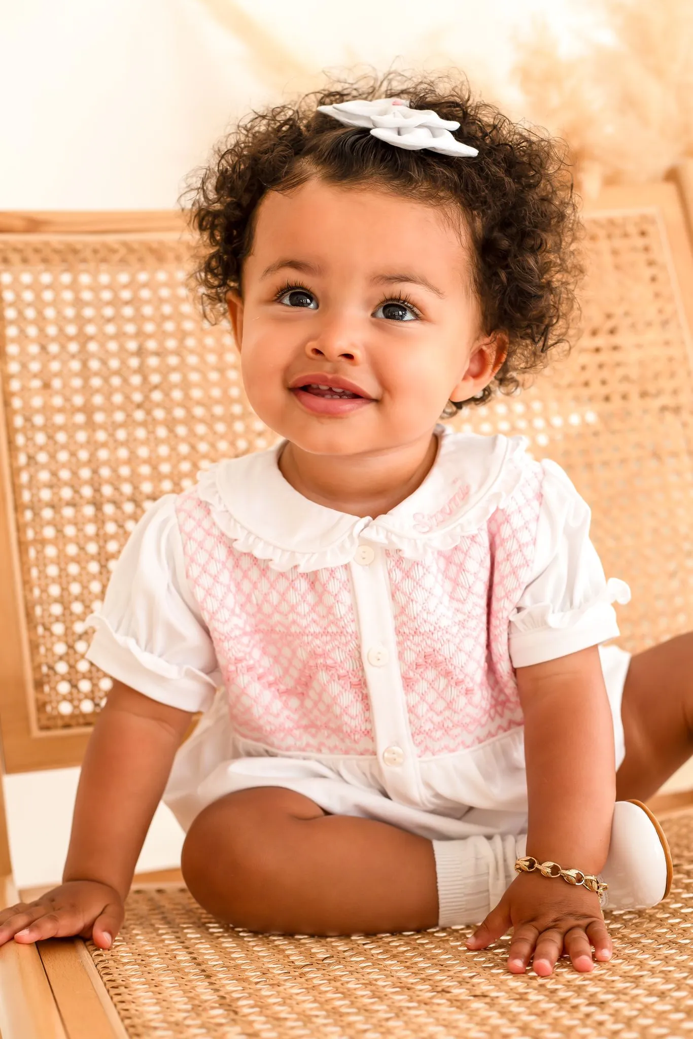 Girls White Smocked Romper Trimmed With Pink